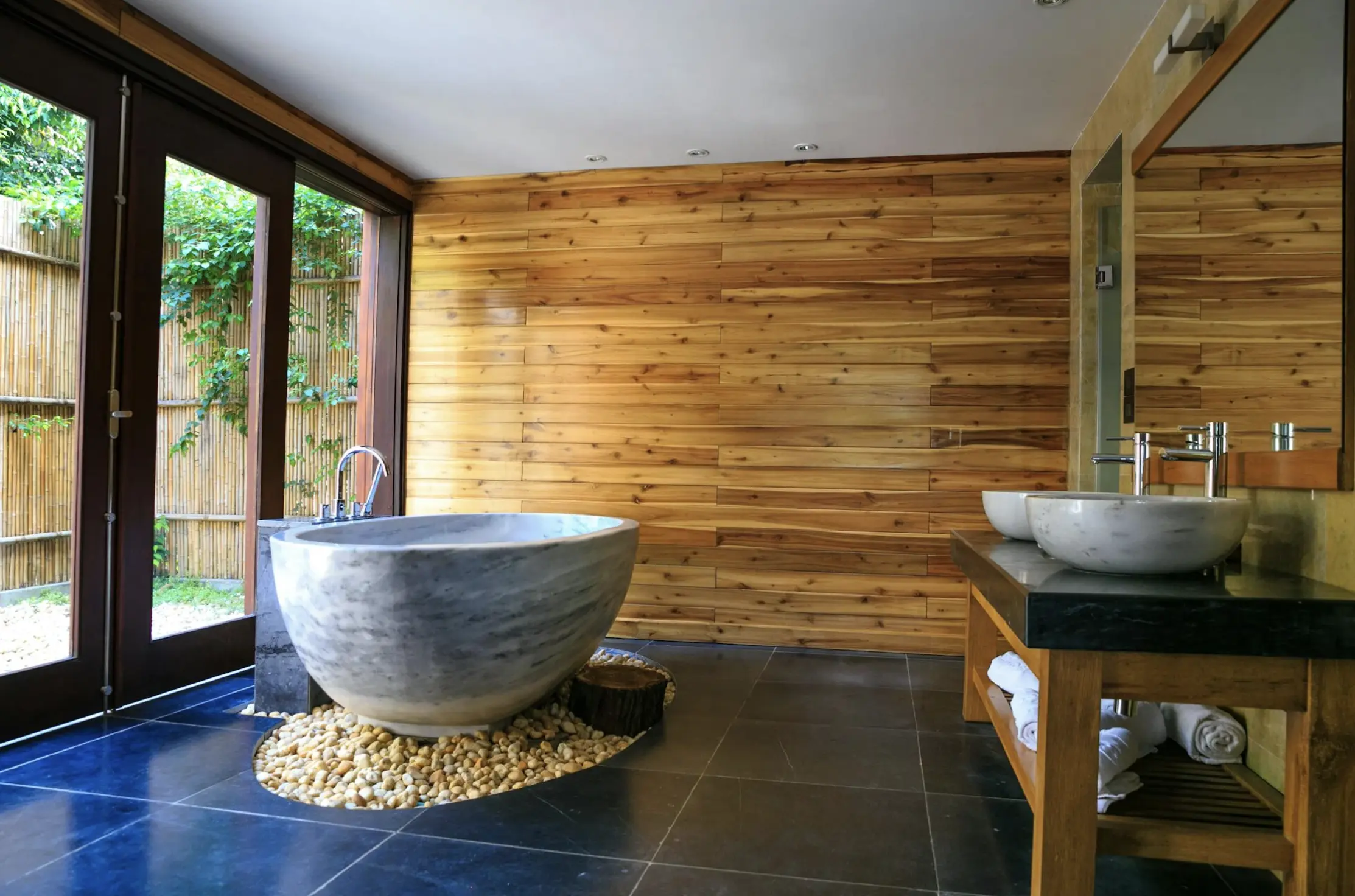 Primary suite with coordinated finishes across bedroom, bath, and closet
